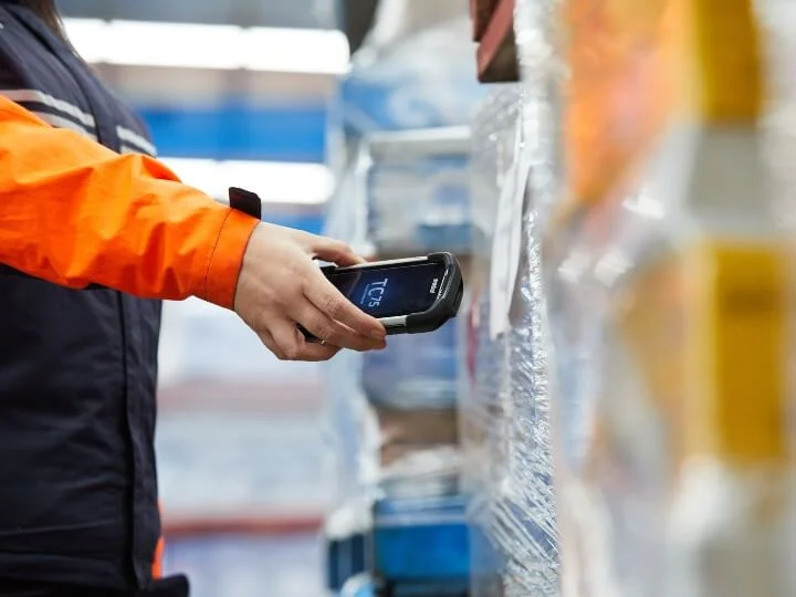 Chemcouriers Team Member scanning freight