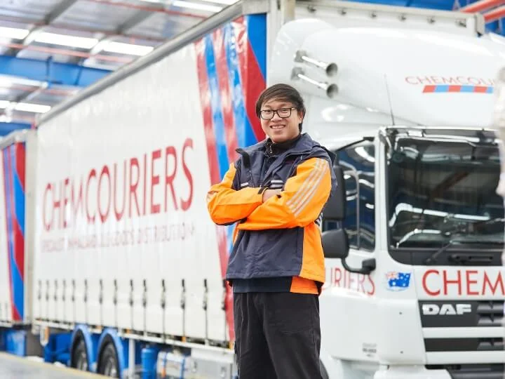 Chemcouriers Owner Driver standing in front of B-Double